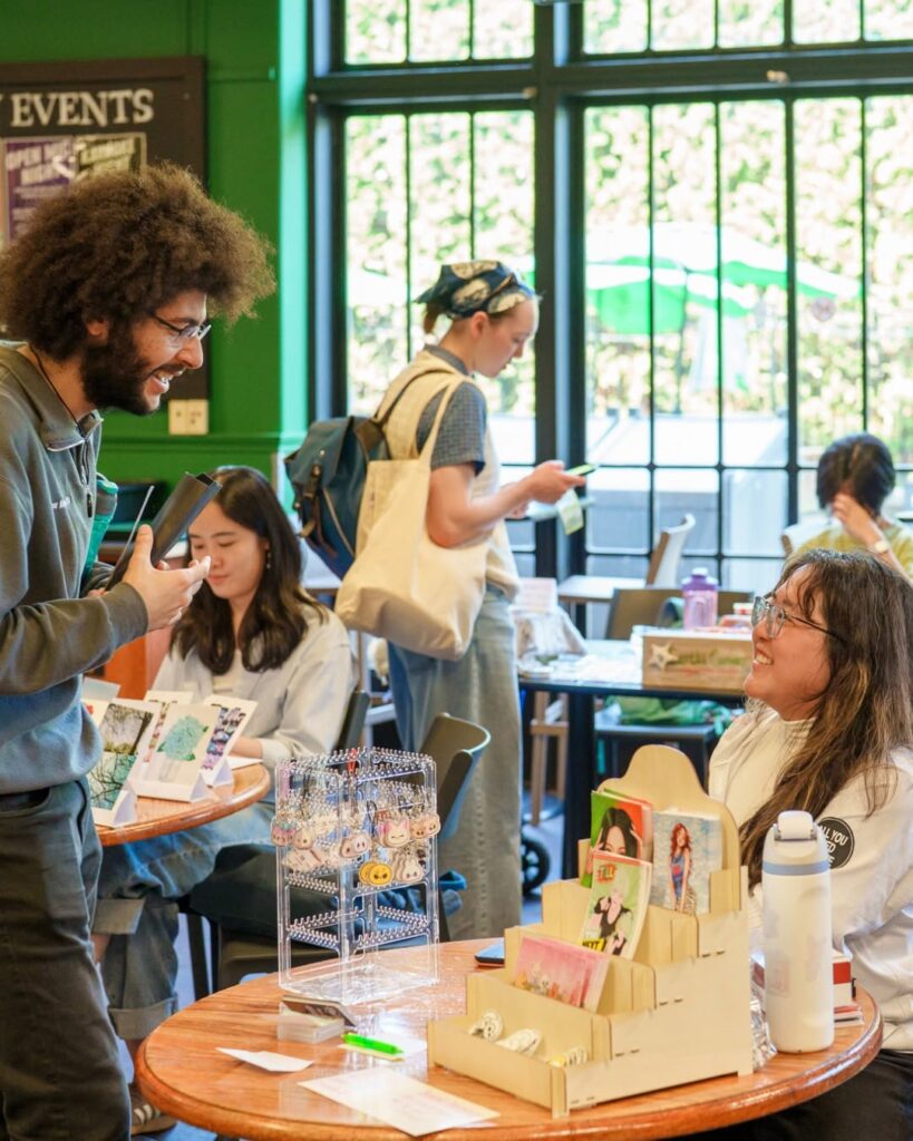 vendors and patrons at a previous makers market